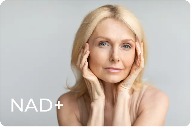 Older woman touching her face
